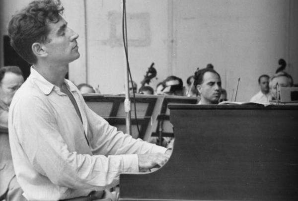 Leonard Bernstein playing piano at Lewisohn Stadium, 1947. (Copyright: Ruth Orkin Photo Archive. Used by permission, courtesy of Mary Engel. All rights reserved.)