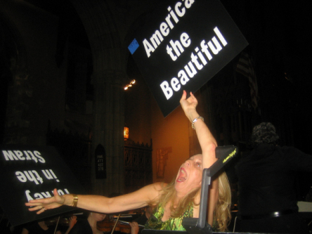 Woman dropping signs while looking stressed.