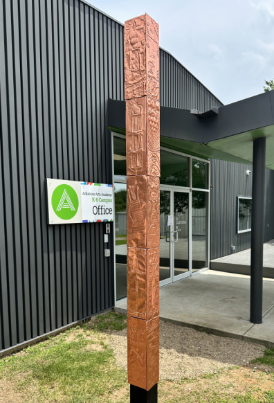 Square Column covered in copper tiles with raised relief designs