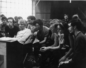 Leonard Bernstein sits at the piano with Tanglewood Music Center conducting fellows, ca. 1976. Photo by Heinz Weissenstein (Whitestone Photo)